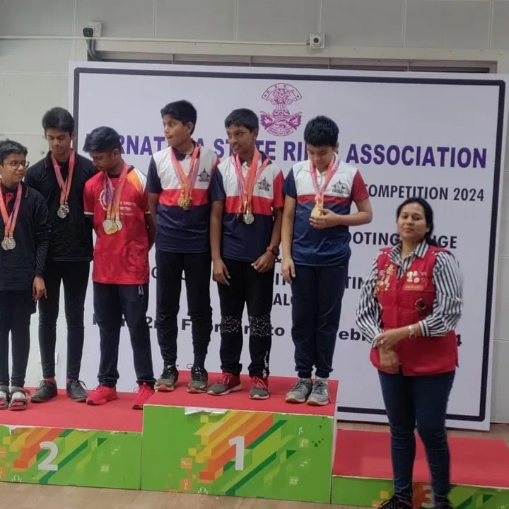 The result of dedication and expert coaching. Our students are seen here on the podium at the Karnataka State Rifle Association Competition in 2024, a testament to the effectiveness of our training programs.