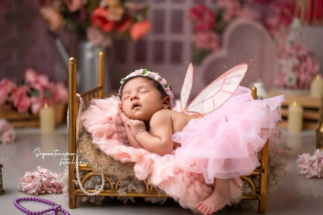 The magic of new life is captured in this enchanting butterfly-themed newborn shoot. We style every detail, from the delicate wings to the floral setting, to turn your baby's first portraits into a fairytale.