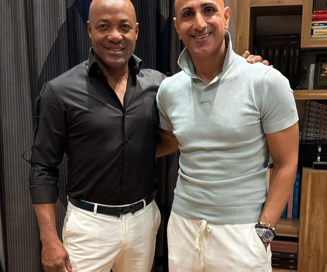 It was an honor to dress the legendary cricketer Brian Lara. This look, featuring a sharp black shirt and crisp white trousers, is a testament to how I tailor style for champions.