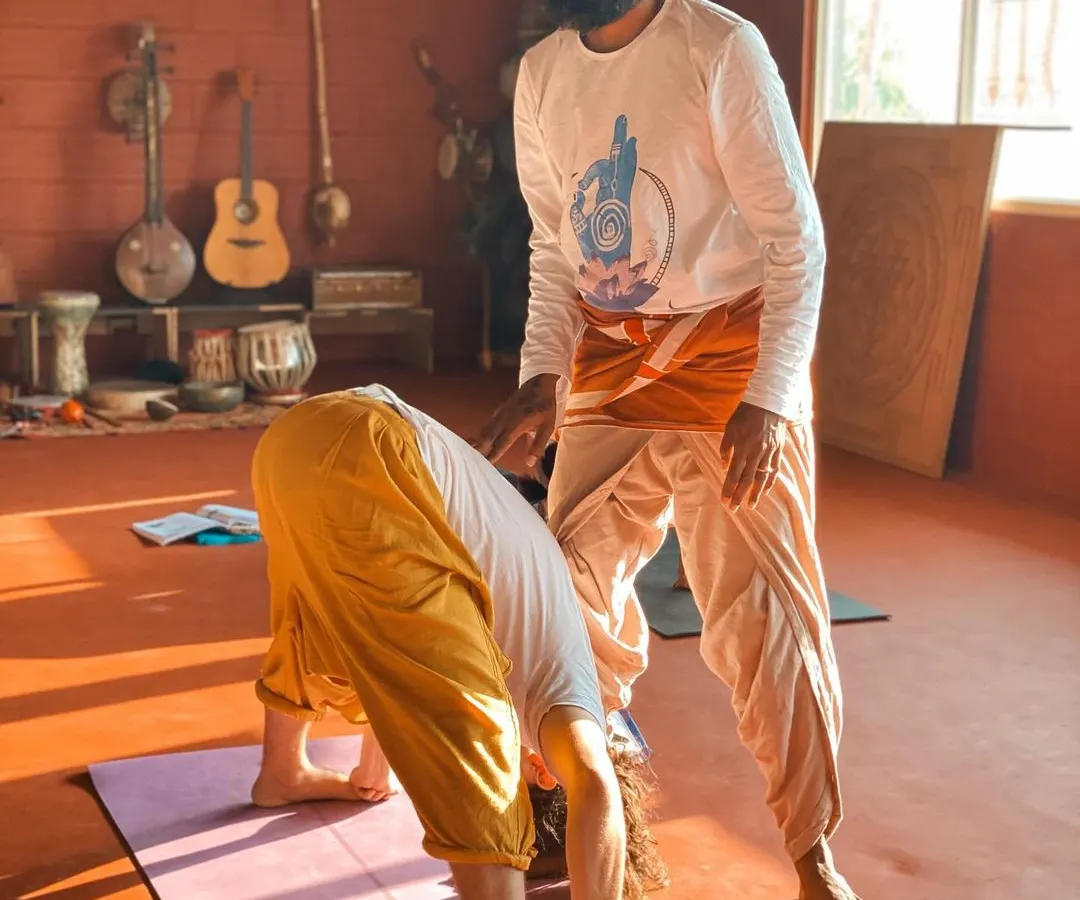 In our 300-hour yoga therapy course, personal attention is key. I provide hands-on adjustments to help you understand the subtleties of alignment, ensuring you can safely guide your own students through poses like Prasarita Padottanasana (Wide-Legged Forward Bend).