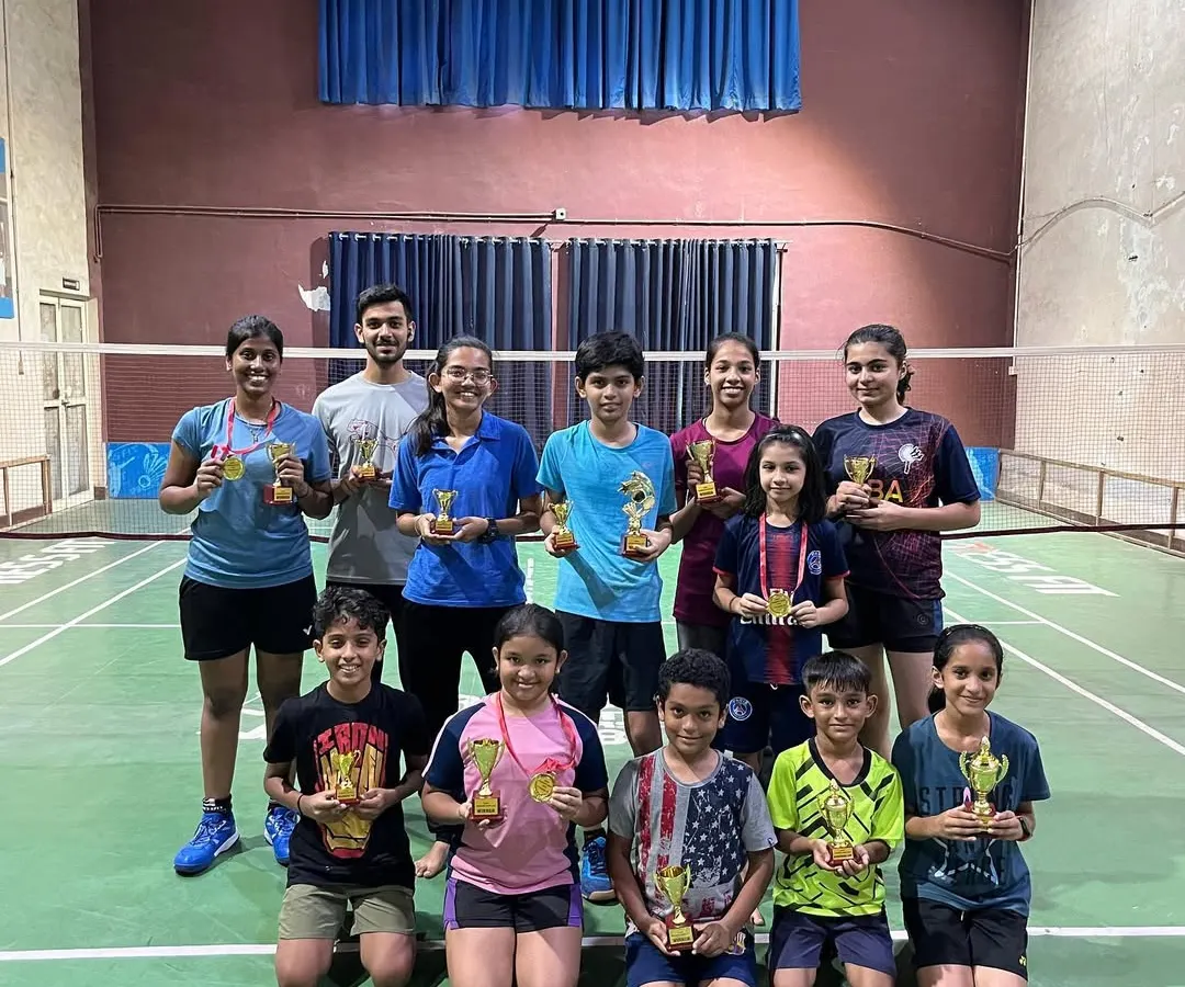 A group of proud winners from a summer camp tournament I managed. My goal is to create an environment where every player, from young kids to adults, gets a chance to compete and celebrate their success.