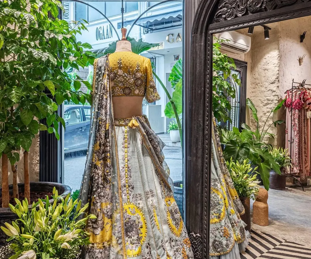 Our design philosophy for retail spaces is to let the product take center stage. Here, a neutral backdrop of lime-plastered walls and carefully curated lighting ensures this stunning designer lehenga is the main focus, demonstrating how thoughtful interior design can enhance the merchandise.