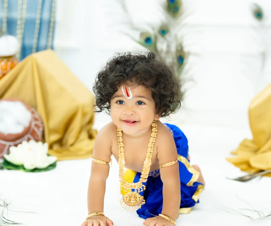I absolutely adore creating these timeless Little Krishna portraits. This little boy, with his beautiful curly hair and sweet smile, looks divine against the backdrop of peacock feathers, capturing the spirit of Krishna Janmashtami.