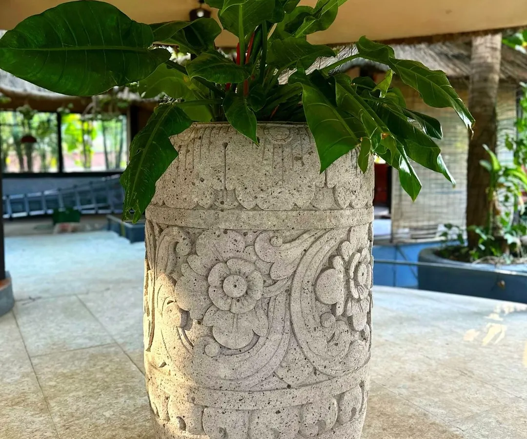 I'm so proud of the bestseller 'Puspa' planter, now available in a grand 120 CM size. The intricate, hand-carved floral details on this lavastone piece showcase the incredible skill of my Balinese artisans.