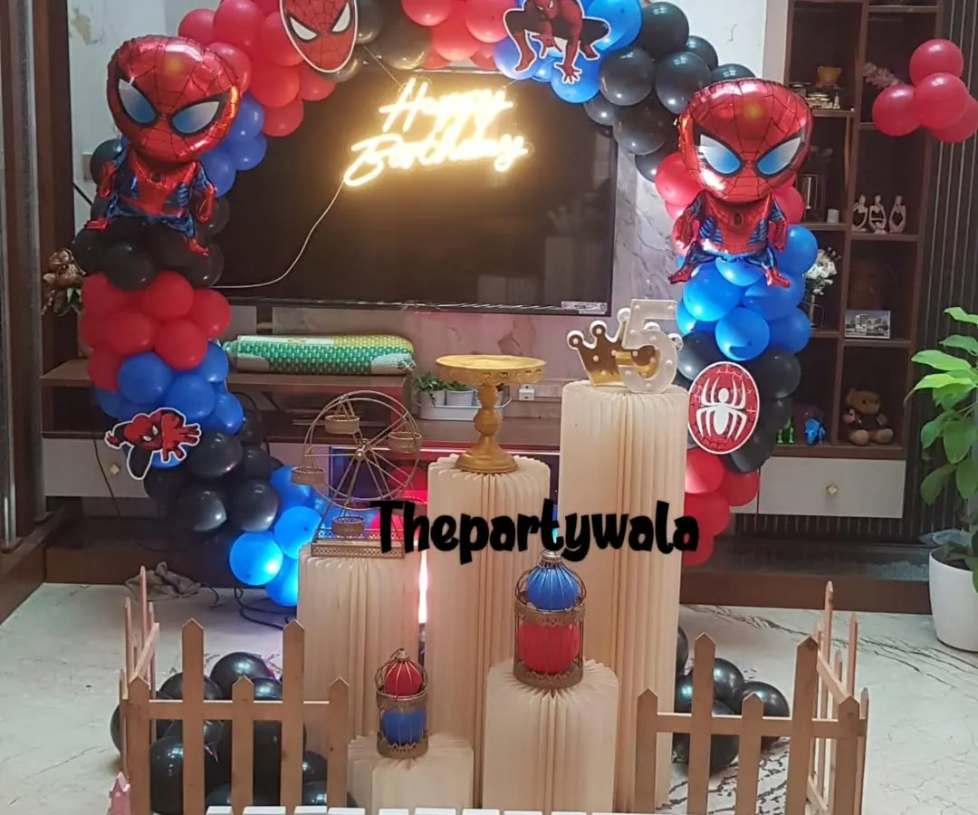 Your friendly neighborhood Spiderman is here! This action-packed setup features a massive red, blue, and black balloon arch, Spiderman cutouts, and a cool "Happy Birthday" neon sign that really makes the whole thing pop. It's a super choice for any little hero's birthday bash.