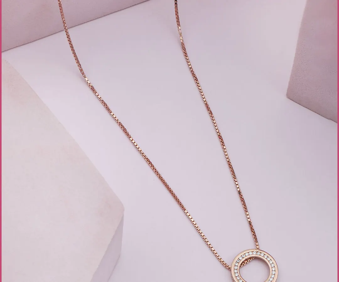 The essence of quiet luxury. This delicate Circle of Eternity pendant in rose gold is a testament to timeless design, perfect for adding a touch of grace to your daily ensemble or for elegant layering.