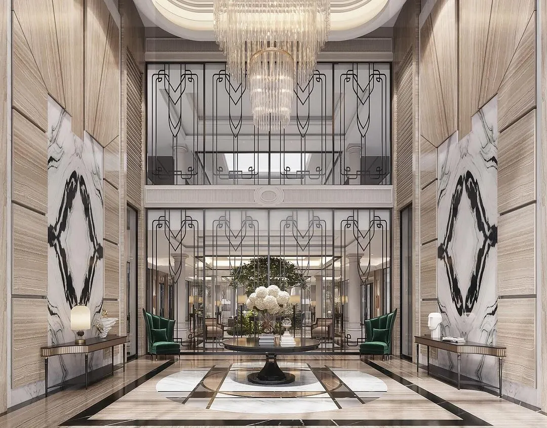 We designed this double-height foyer as a grand welcome. The space is defined by book-matched marble walls and a magnificent crystal chandelier, establishing a narrative of timeless grandeur and neoclassical elegance from the moment you step inside.