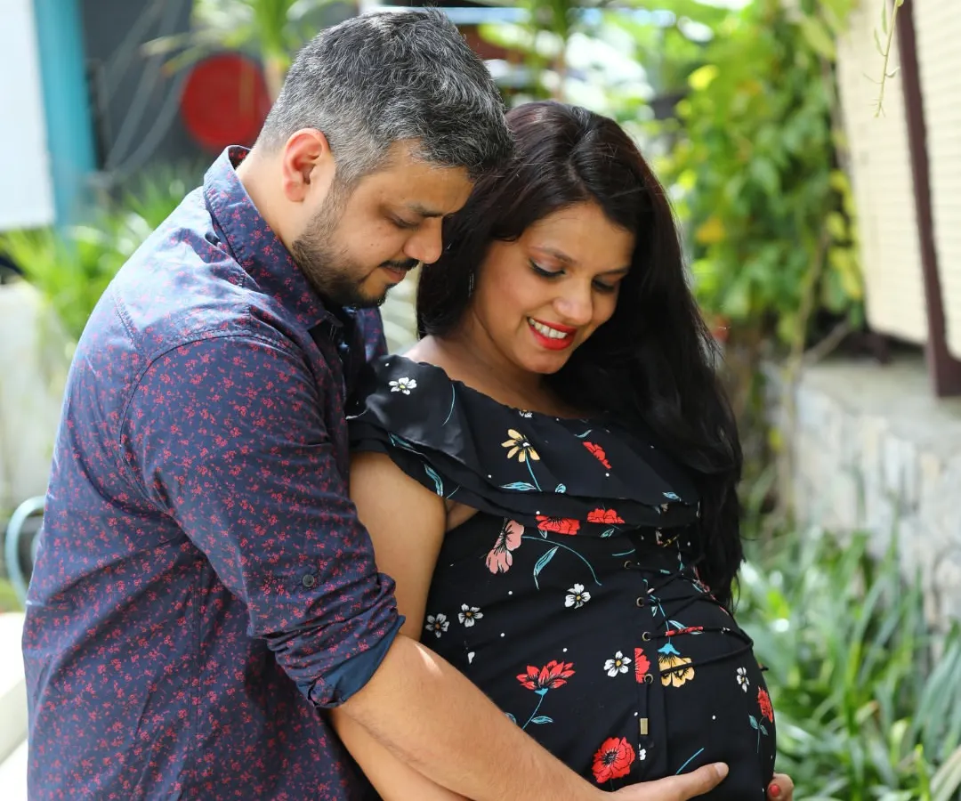 The journey to parenthood is a special chapter worth remembering. We specialize in outdoor maternity photoshoots in Bangalore, finding beautiful natural light to create warm and intimate portraits like this one.