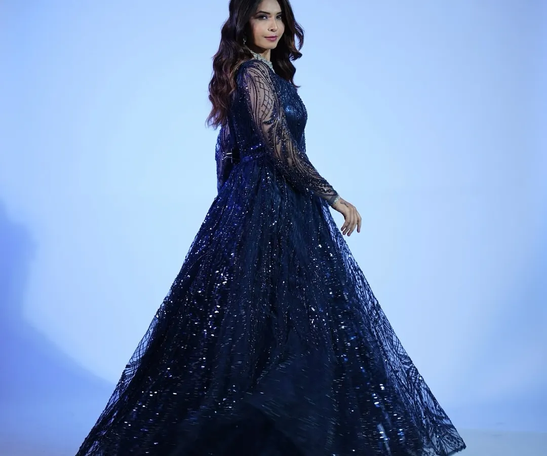 Serving you Cinderella vibes, but make it smart. This midnight blue sequin gown is pure magic for any reception or cocktail night, proving fairy tales don't need a big budget.