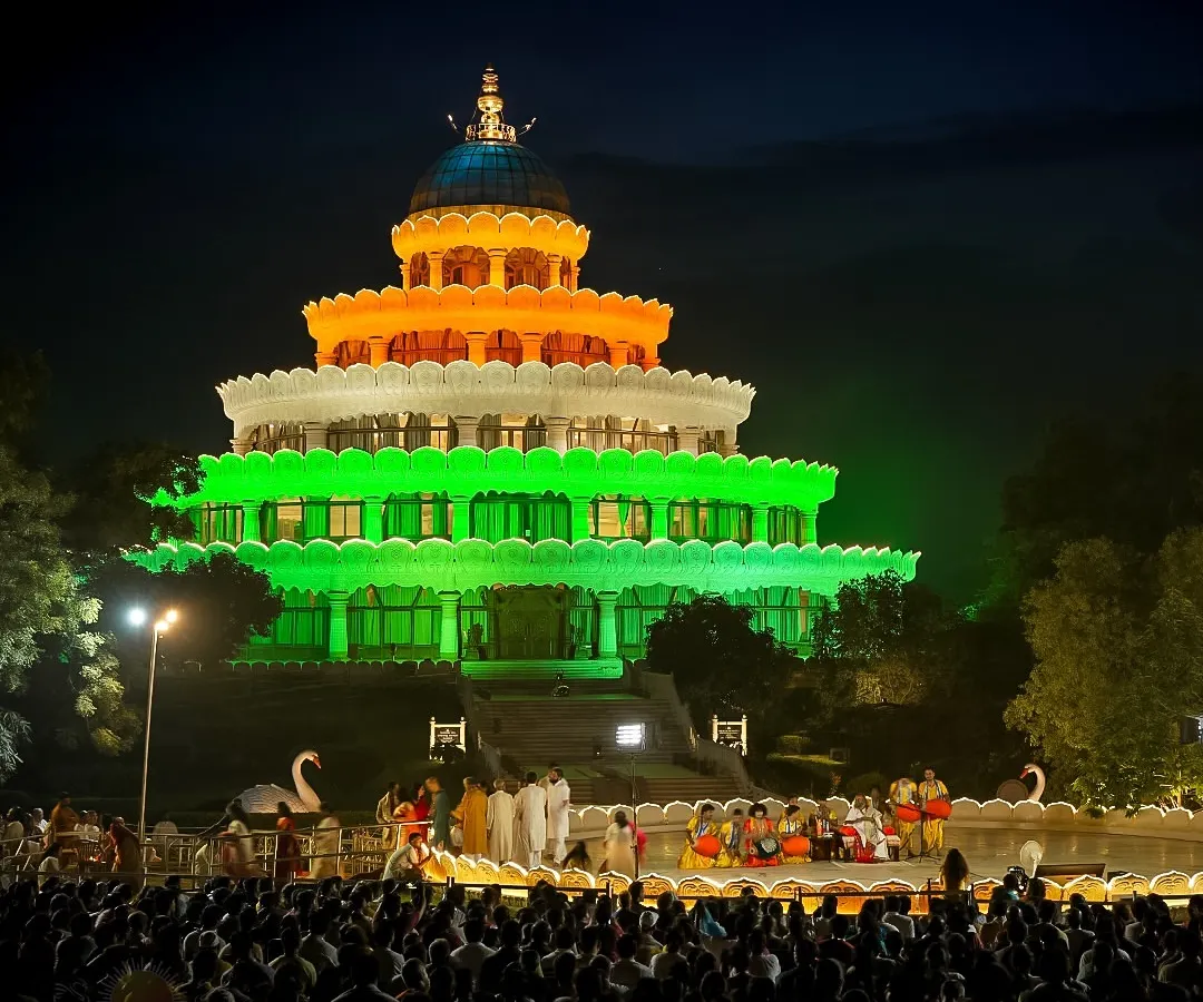 The iconic Vishalakshi Mantap, our lotus-shaped meditation hall, illuminated in the colors of the Indian flag during Independence Day celebrations. It stands as a beacon of peace and unity for all who visit.