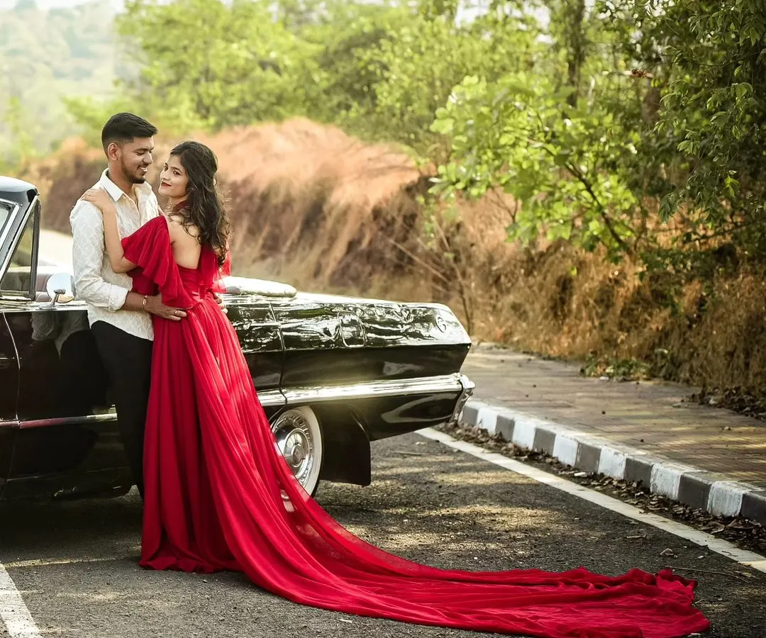For couples who love a classic vibe, we incorporate elements like vintage cars to add timeless charm to your photoshoot. This pre-wedding session combined a bold red gown with a classic Chevrolet for an unforgettable look.