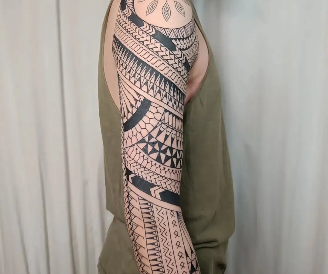 This full, freehand Maori sleeve is a testament to cultural storytelling through ink. Each pattern is drawn directly onto the skin to flow with the body's form, representing a unique journey of strength and heritage.
