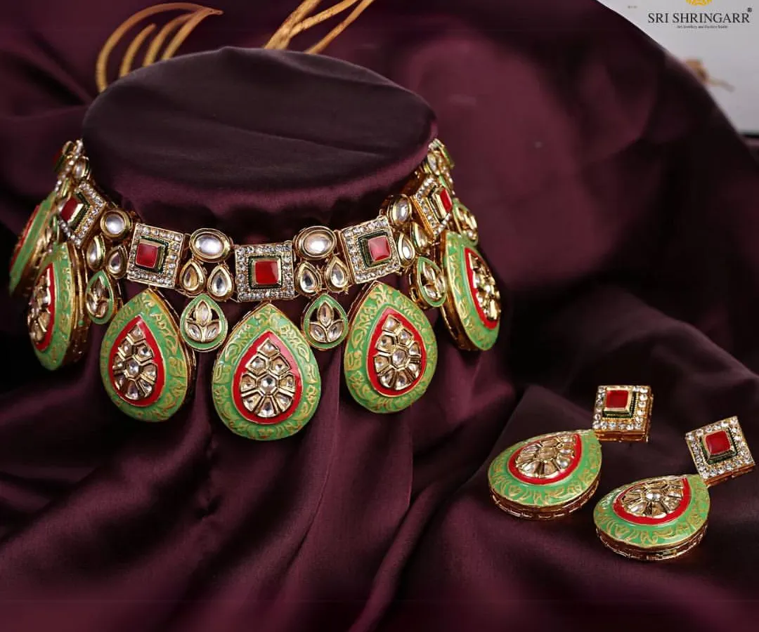 A close-up of one of my favorite Kundan and Meenakari sets. The vibrant green and red enamel work is entirely handcrafted, offering a regal look that is perfect for brides who want a touch of unique color.