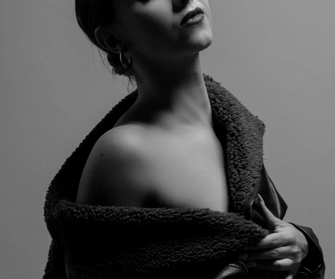 I love the quiet power of black and white. This monochrome portrait focuses on pure emotion, using soft, directional light to sculpt the subject's features and create a timeless, introspective mood.