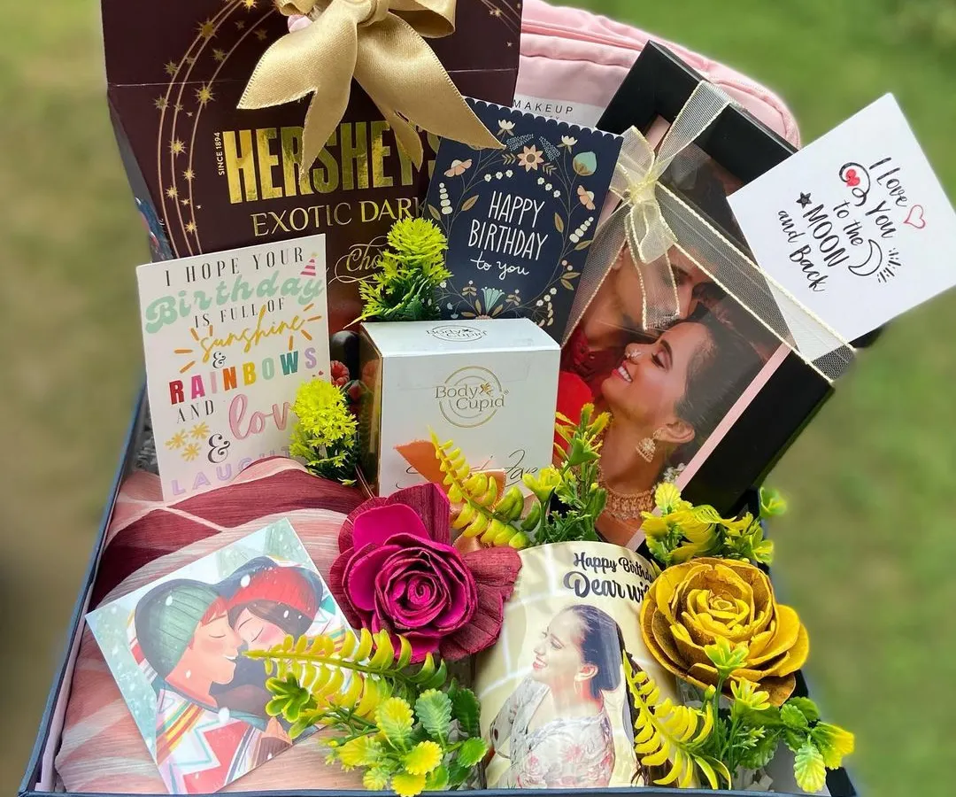 We created this luxurious birthday hamper for a client's wife, and it’s filled with personal touches. It includes a custom photo mug, a stylish scarf, premium Hershey's dark chocolate, Body Cupid perfume, and multiple heartfelt birthday cards, all arranged beautifully in a keepsake box.