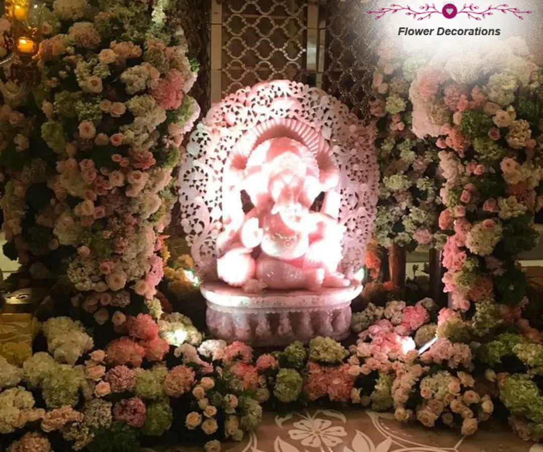 For us, Ganpati decorations are an act of devotion. This elegant pastel pink floral arrangement creates a serene and beautiful sanctuary for Bappa, combining modern aesthetics with traditional reverence in your home.