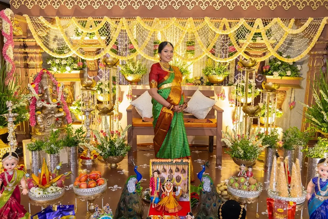 We honor timeless traditions with a touch of rustic elegance. This Seemantham (baby shower) setup features intricate floral arrangements, brass lamps, and peacock details to create a blessed and beautiful celebration.