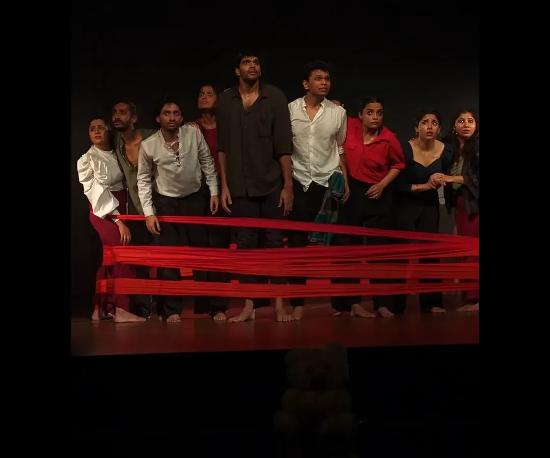 From classroom exercises to the main stage, our work culminates in powerful, original theatre productions. This is a moment from our dance-theatre piece, 'Sea's Fire', where students bring their training and passion to a live audience.