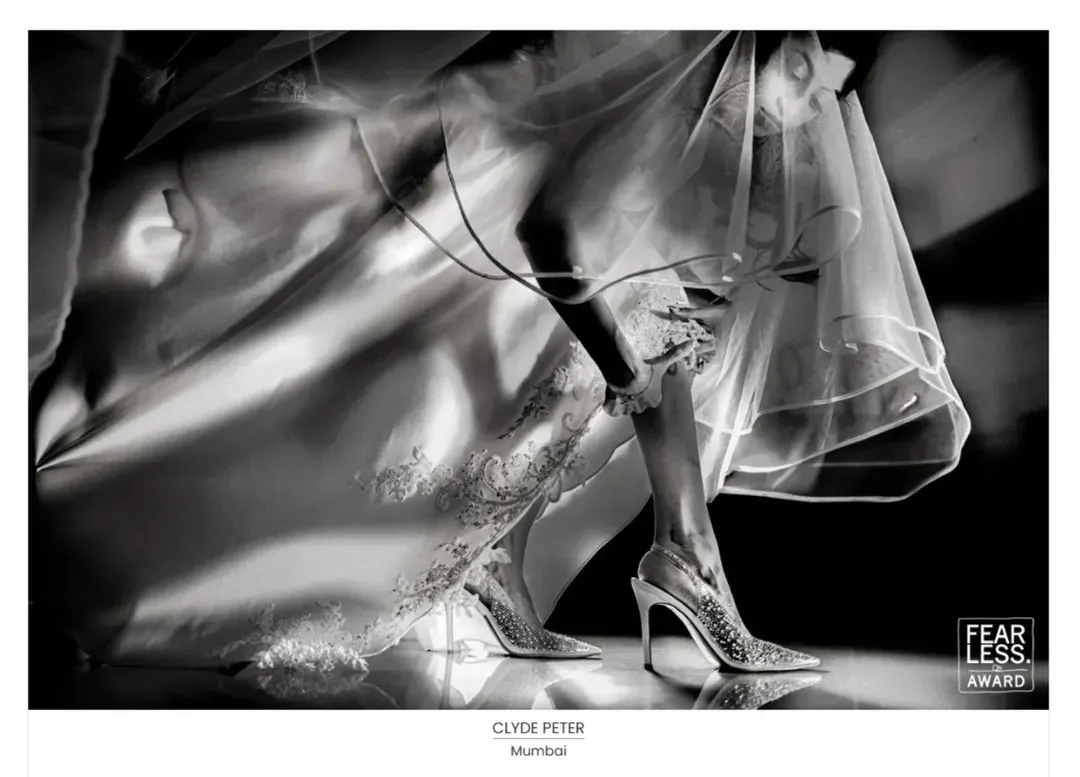 I believe wedding cinematography is an art form. This black and white shot, which won a Fearless Award, captures the quiet, artistic details of a wedding day. It’s about finding beauty in the small moments, like the bride adjusting her garter, and turning them into timeless, cinematic memories.