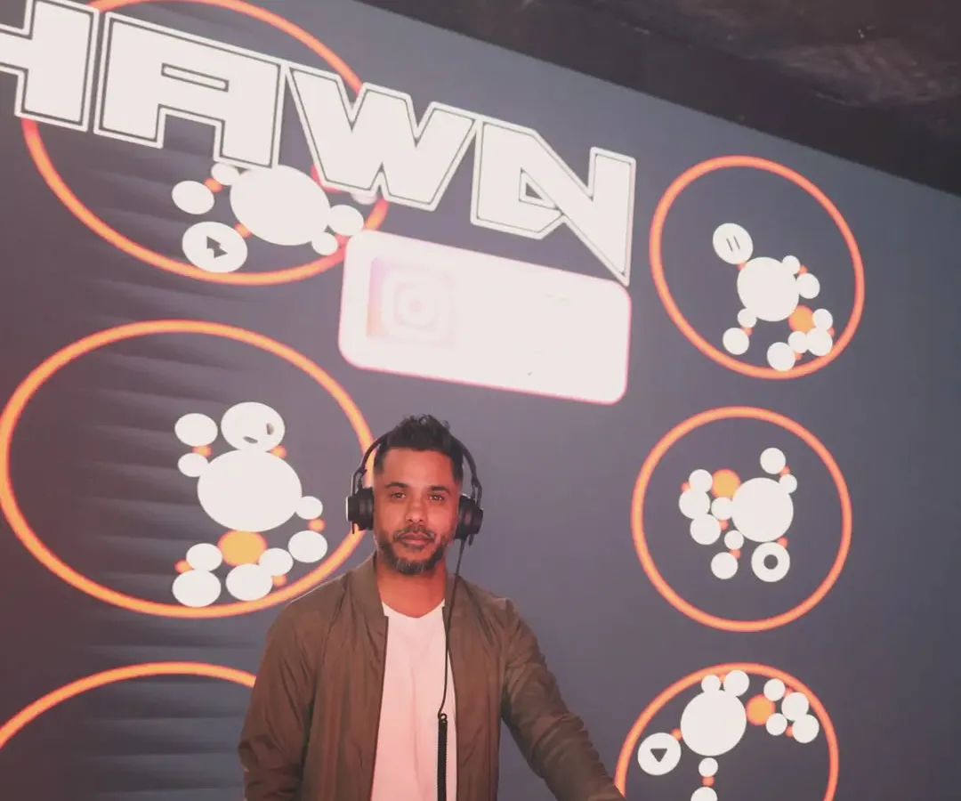 It's not just about playing music; it's about putting on a show. Here I am in my element, with custom VJ graphics lighting up the stage, making sure the visual energy matches the audio.