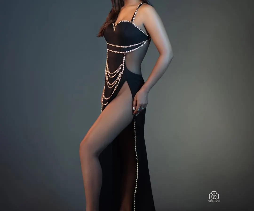 A perfect example of a clean, high-impact studio portrait. I used controlled lighting to sculpt the model's form, emphasizing the lines of the black gown and the strength of the pose. This is the kind of sharp, modern fashion shot I specialize in.