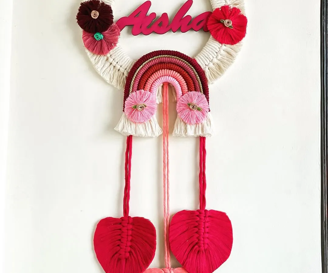 I adore making personalized gifts, and this name hanging for Aisha was a joy to create. Combining a custom nameplate with a rainbow and delicate macrame leaves makes for a perfect nursery decoration.