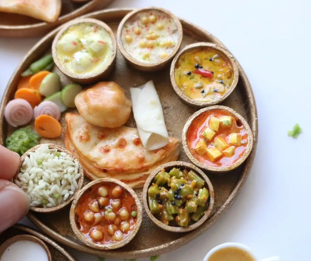 Look at the detail in this North Indian thali. I love recreating the textures of each dish, from the creamy paneer butter masala to the fluffy rice and soft paratha. It’s a feast for the eyes.