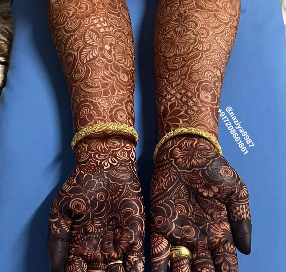The result after two days. I make my own 100% natural henna paste, and this is the deep, rich 'rang' you can expect. Proper aftercare, which I'll guide you on, helps achieve this beautiful, long-lasting bridal stain.