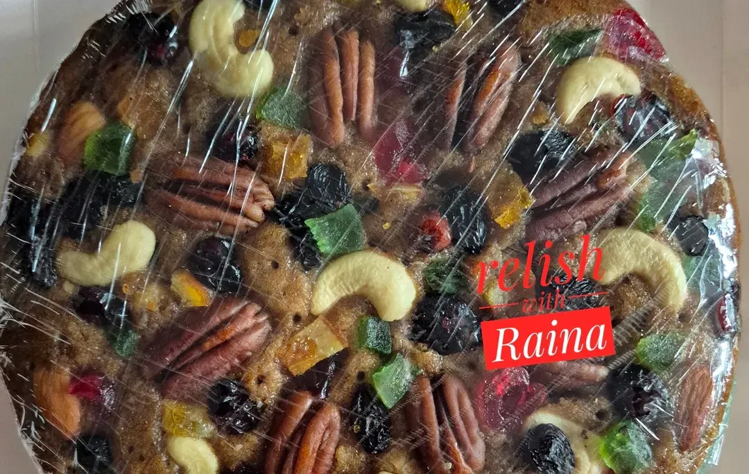 This is a close-up of my traditional Christmas plum cake. You can see how it's loaded with premium nuts like pecans and cashews, and a variety of fruits that I soak for months in rum for that authentic, rich flavour.