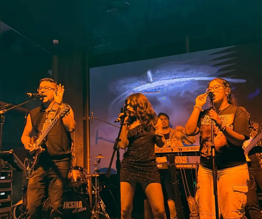 Here I am with the Moksha All Stars, my full-power party band. We love getting on stage together and bringing that big sound for weddings and corporate events, playing everything from rock to pop.