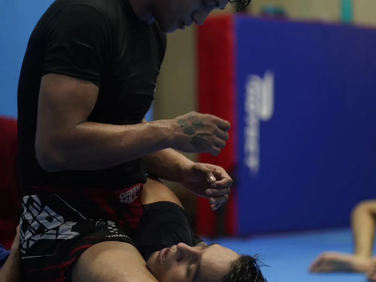 The mat is where the truth is revealed. This is a live grappling roll, a physical chess match where technique and pressure are everything. I teach you how to control the fight on the ground.
