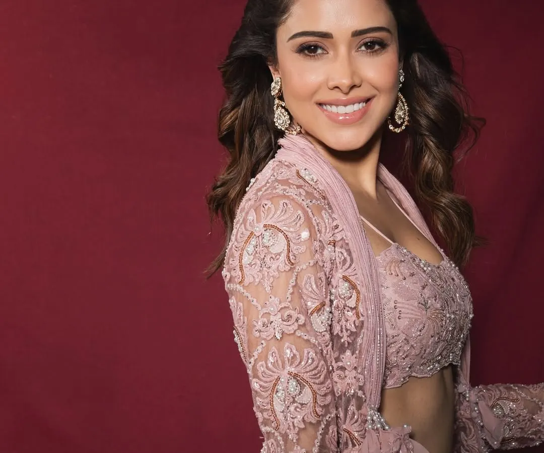 For Nushrratt Bharuccha, we created this dreamy pastel indo-western look, perfect for a sangeet or a daytime wedding. The delicate lacework and modern silhouette show how to blend traditional crafts with contemporary style.