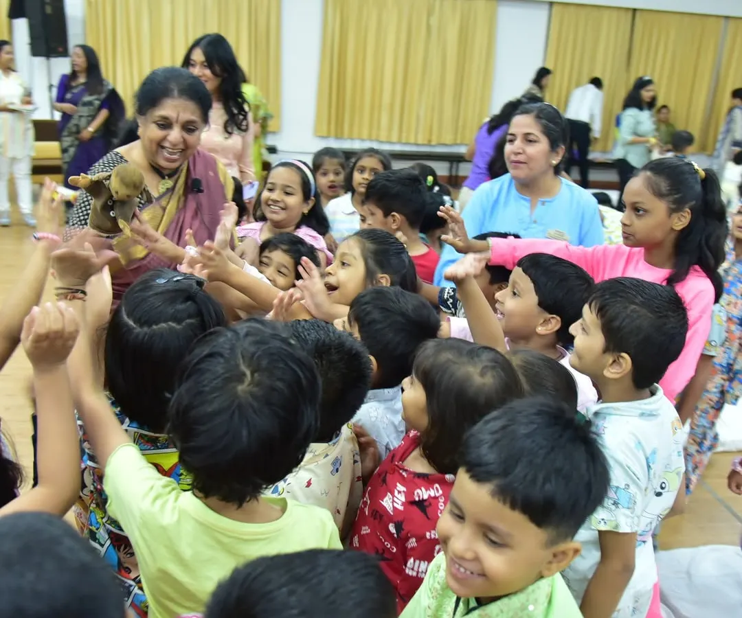 The purest joy is seeing a story reflected in a child's eyes. Here, surrounded by curious young minds at the Fravashi Academy, I am sharing a tale with a puppet friend. This is where the magic is most real, in these moments of shared wonder and laughter.