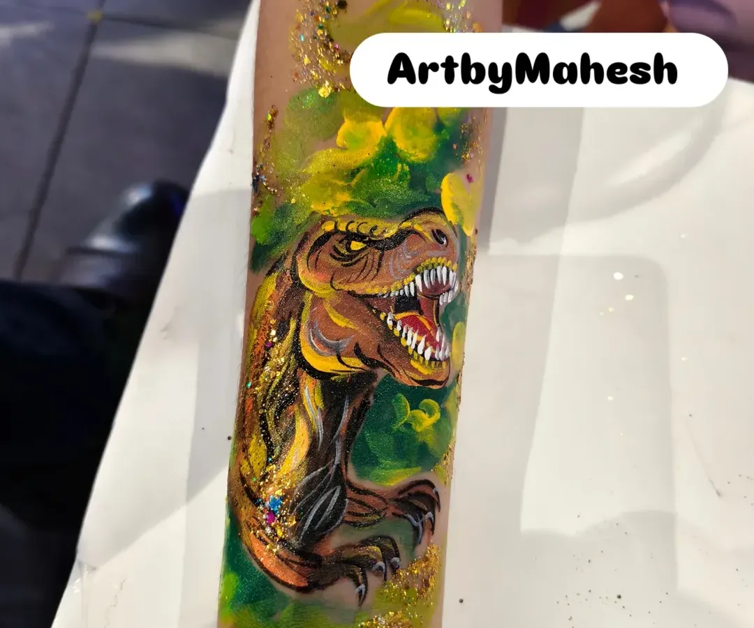 This isn't just for kids. I also create detailed and realistic body art, like this fierce T-Rex temporary tattoo, perfect for themed events or anyone wanting to make a bold statement.