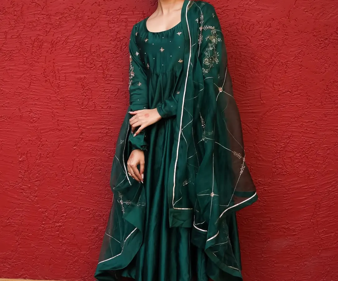 In the studio, we can create timeless elegance. This shot shows how a strong color, a beautiful outfit, and confident posing come together for a powerful and regal portrait, perfect for brand lookbooks or personal portfolios.