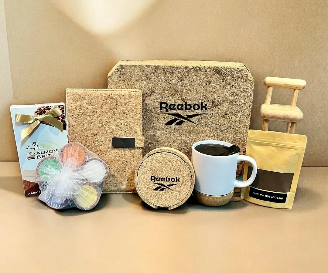 I love collaborating with brands that share a vision for quality and sustainability. This corporate Diwali hamper for Reebok features a custom-branded plantable gift box made from coconut fibre, a cork notebook, coasters, and a mug, paired with gourmet treats.