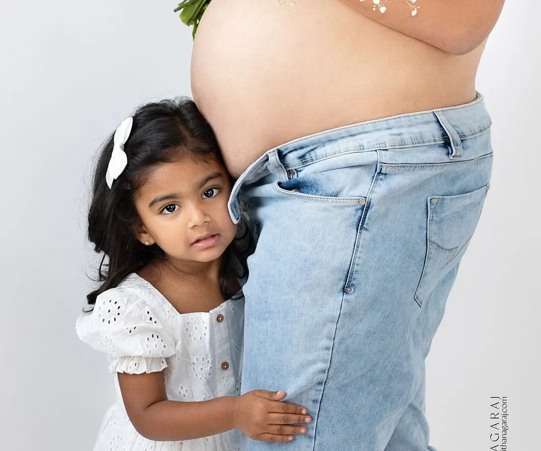 The wait is a family affair. I love including older siblings in maternity sessions, capturing their excitement and curiosity as they anticipate their new best friend. This is a portrait of your family, just as it is, right before it grows by two little feet.
