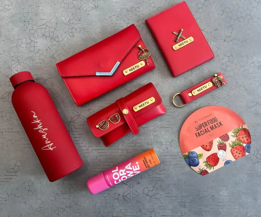 I love creating color-coordinated gift sets for her. This vibrant red collection features a personalized clutch, passport holder, keychain, and eyewear case, all with matching nameplates and charms. It's a complete, stylish set perfect for birthdays or anniversaries.