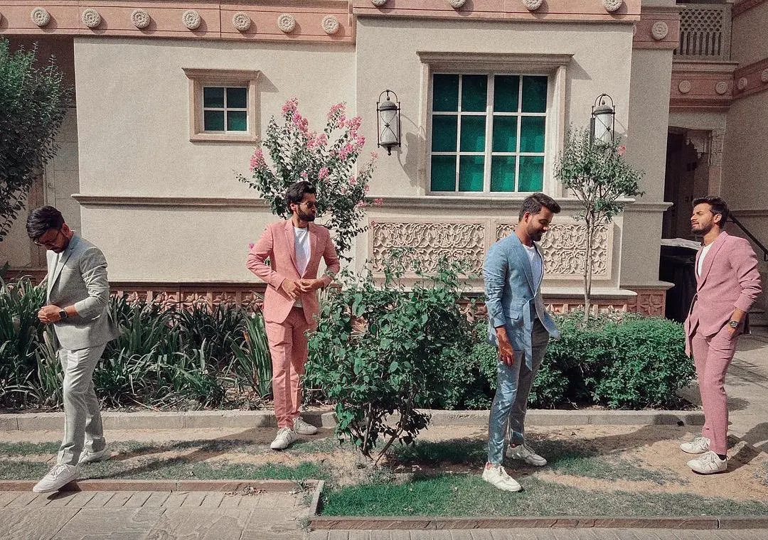 A suit should reflect your personality, whether that's classic or contemporary. Here you can see my work in a variety of styles, from a sharp light grey to a bold pink, all custom-made. These versatile pieces show how a bespoke suit can be styled for any occasion, even paired with sneakers for a modern look.