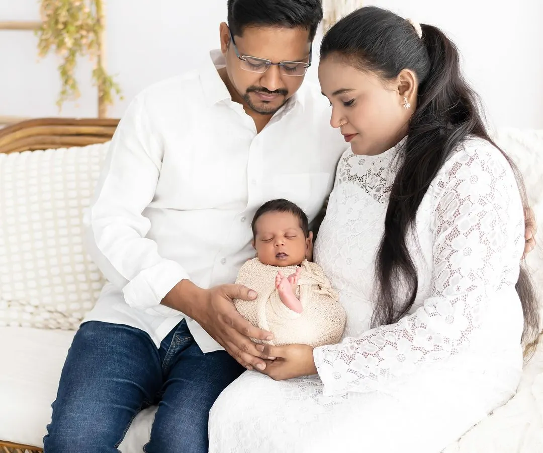 There is nothing more pure than new parents holding their greatest treasure. We focus on creating a calm and serene atmosphere for these first family portraits, using soft, natural light and simple white outfits to keep the focus on the love and connection.