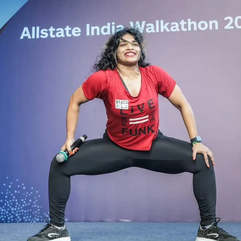 Fitness should also be fun, and my Zumba sessions are pure energy. Here I am leading a warm-up at the Allstate India Walkathon, bringing the fire and getting everyone moving. We dance, we sweat, and we feel alive.