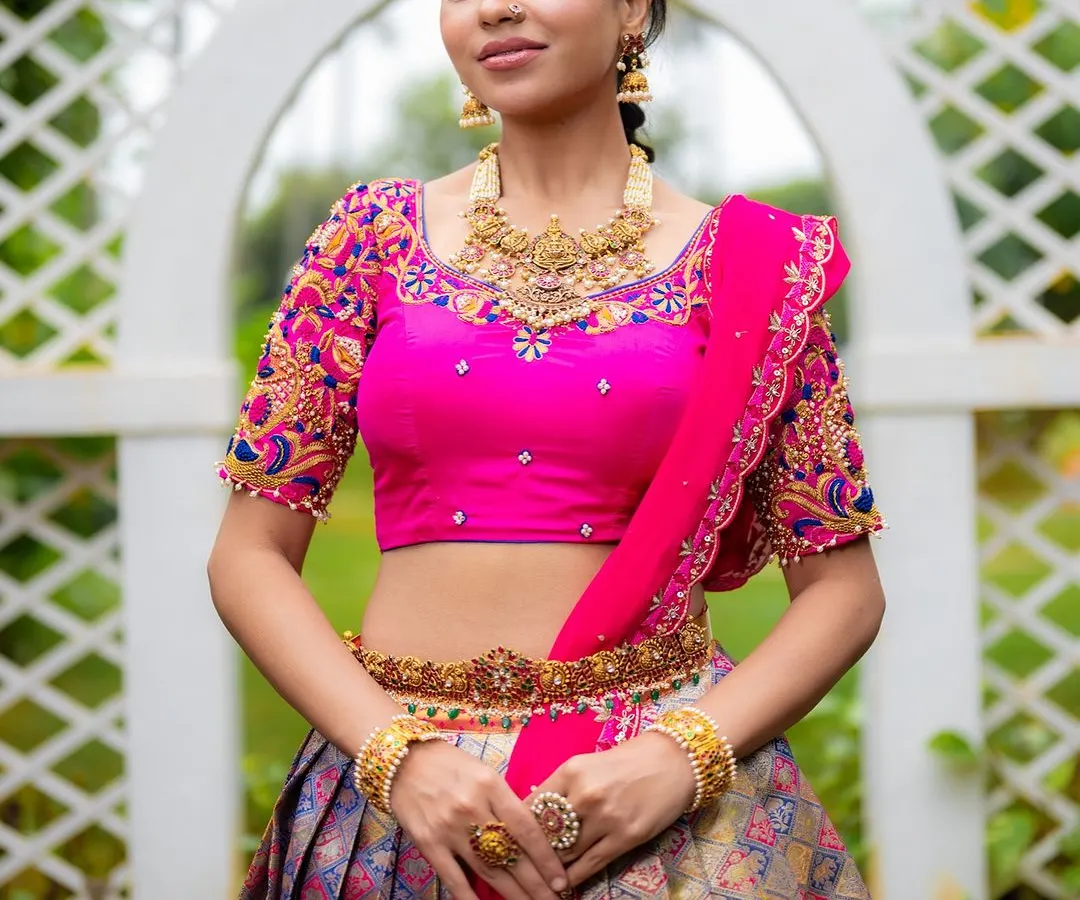 For ethnic wear brands, I focus on capturing the richness of the fabric and the intricacy of the design. This full-length shot of a Kanjeevaram half saree uses bright, natural lighting to make the vibrant pink blouse and detailed embroidery pop, perfect for a designer lookbook.