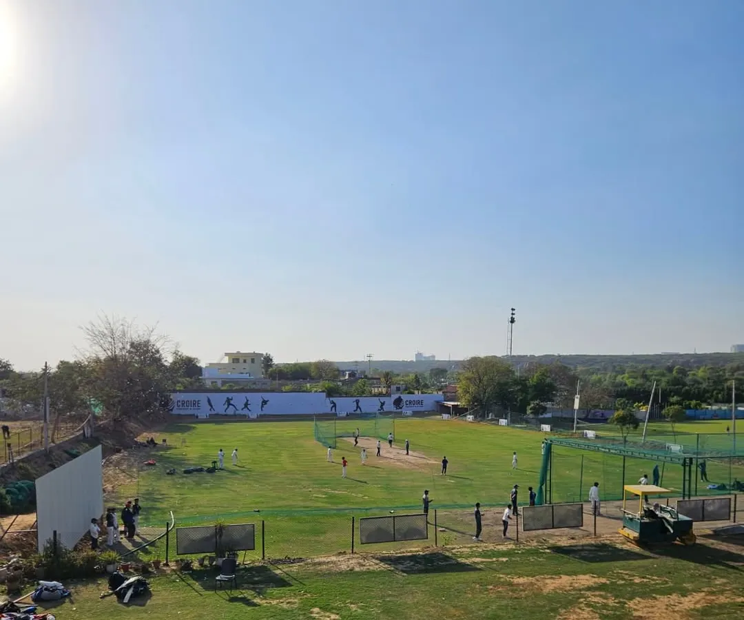 Our academy in Gurgaon is a complete ecosystem for a cricketer's development. This wide view shows our expansive grounds, multiple nets, and practice wickets, providing a professional environment where players can focus entirely on their game, away from distractions.