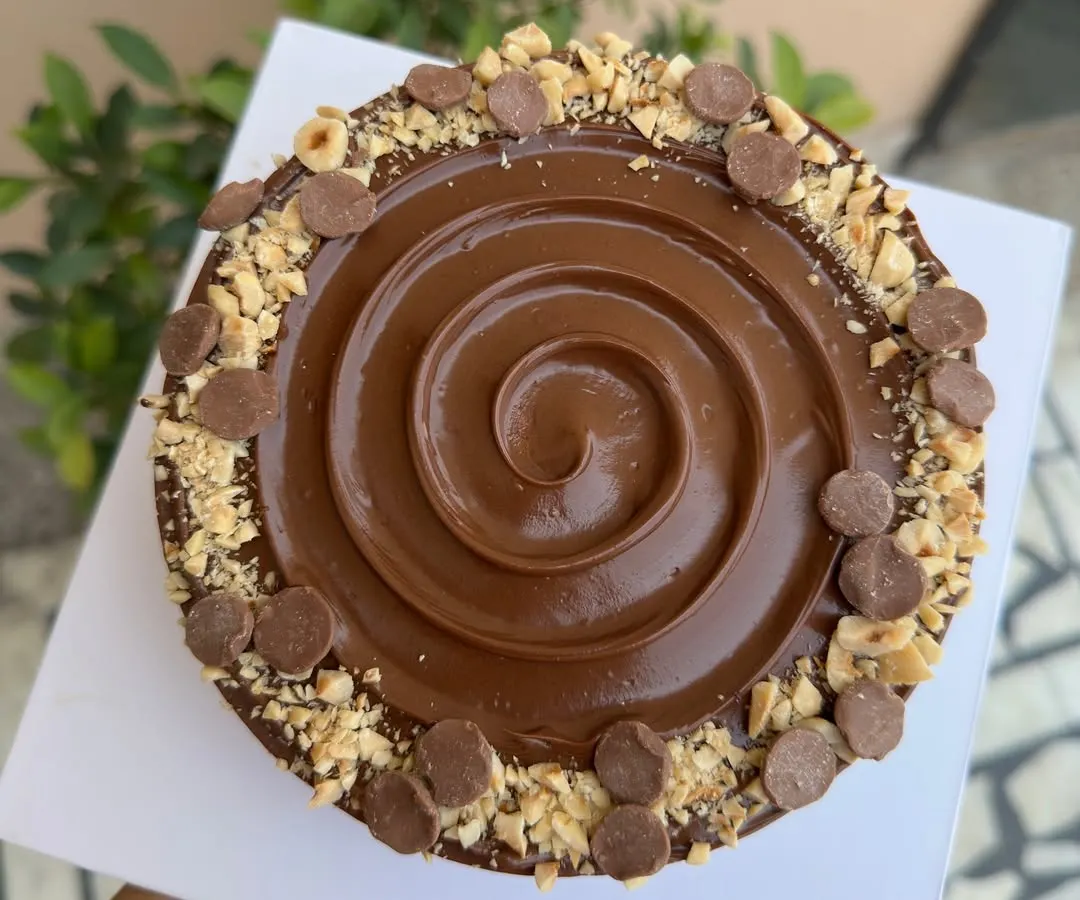 My Nutella Hazelnut Cheesecake is pure indulgence. I create a rich, creamy cold-set cheesecake swirled with Nutella, set on a crunchy biscuit base, and topped with roasted hazelnuts and chocolate chips.