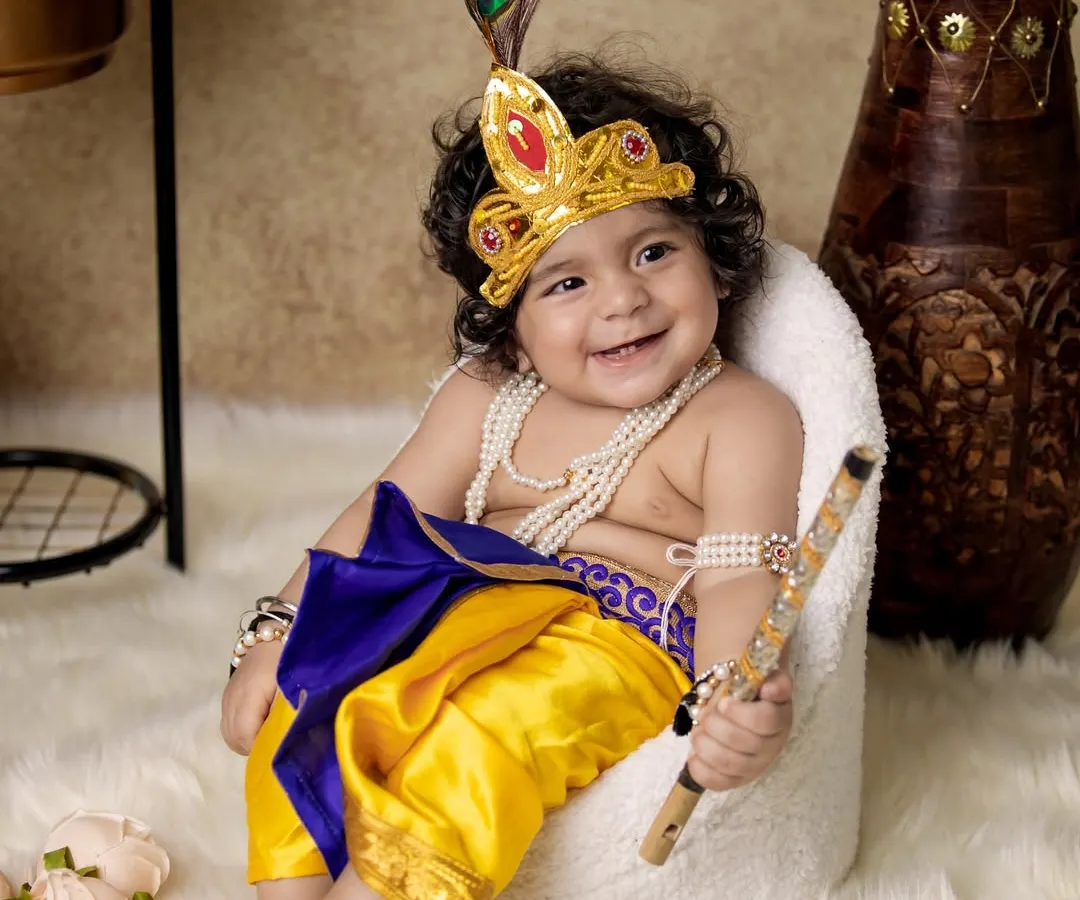 This is one of my most popular shoots, the Janmashtami special. I bring the entire setup, including the costume, props, and backdrop, to your home so your little Krishna can have his moment without any fuss.