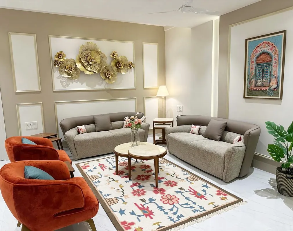 For this South Mumbai residence, we crafted a living space that balances contemporary elegance with inviting warmth. The custom rug, plush upholstery in terracotta and taupe, and curated wall art create a sophisticated yet comfortable family haven.