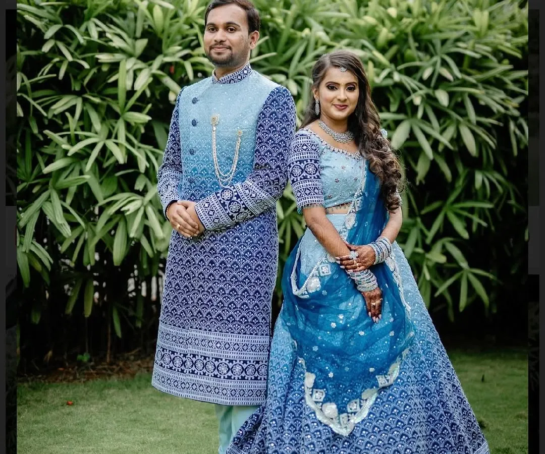 I believe a wedding is a celebration of two people, and their outfits should reflect that harmony. Here's a custom designed couple twinning lehenga and sherwani set in a striking blue, created to make sure they shine together.