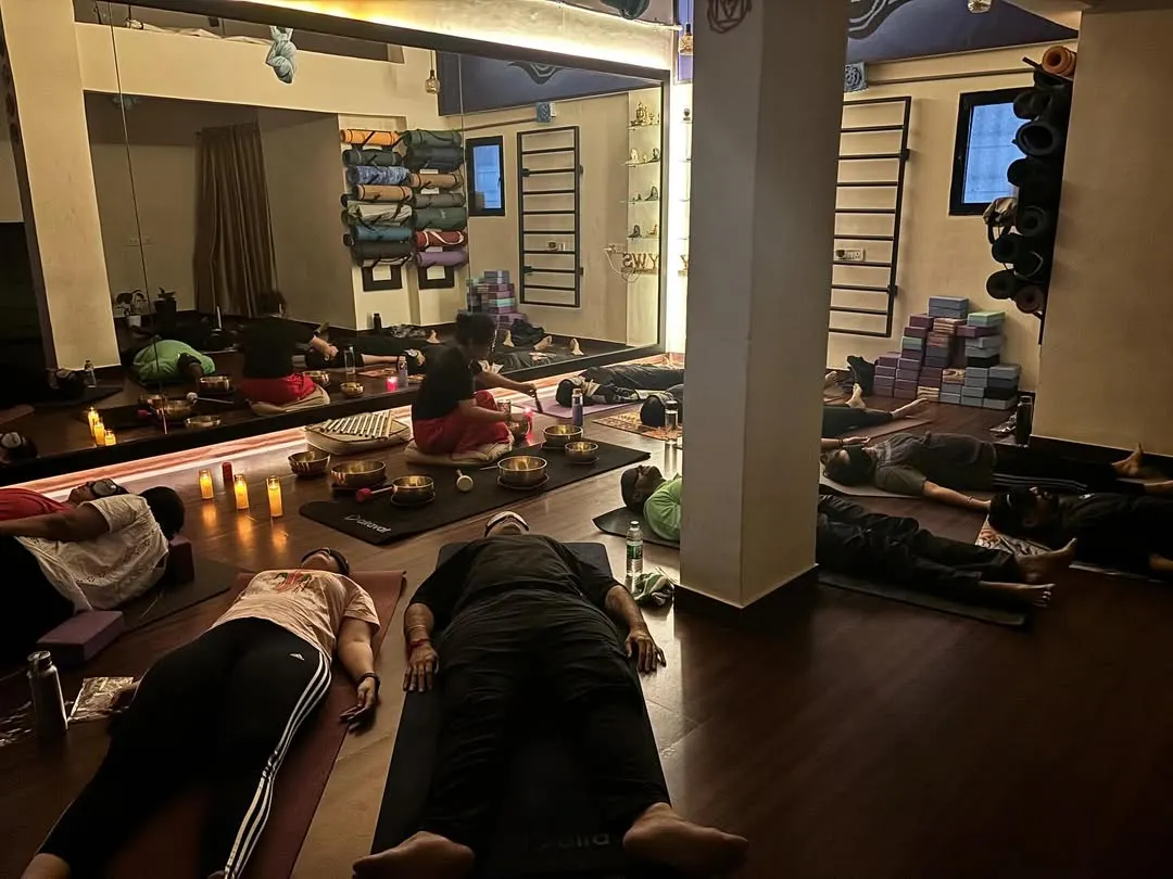 This is a moment from one of our Naada Yoga sessions. Students rest in Savasana, absorbing the healing vibrations of Tibetan singing bowls. It's a practice of deep surrender and rejuvenation for the mind and body.