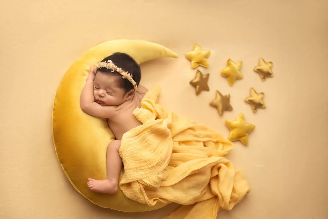 Let me create a little magic for your baby. This celestial moon and stars setup is one of my most requested themes, perfect for capturing your little one's dreamy start in the world.