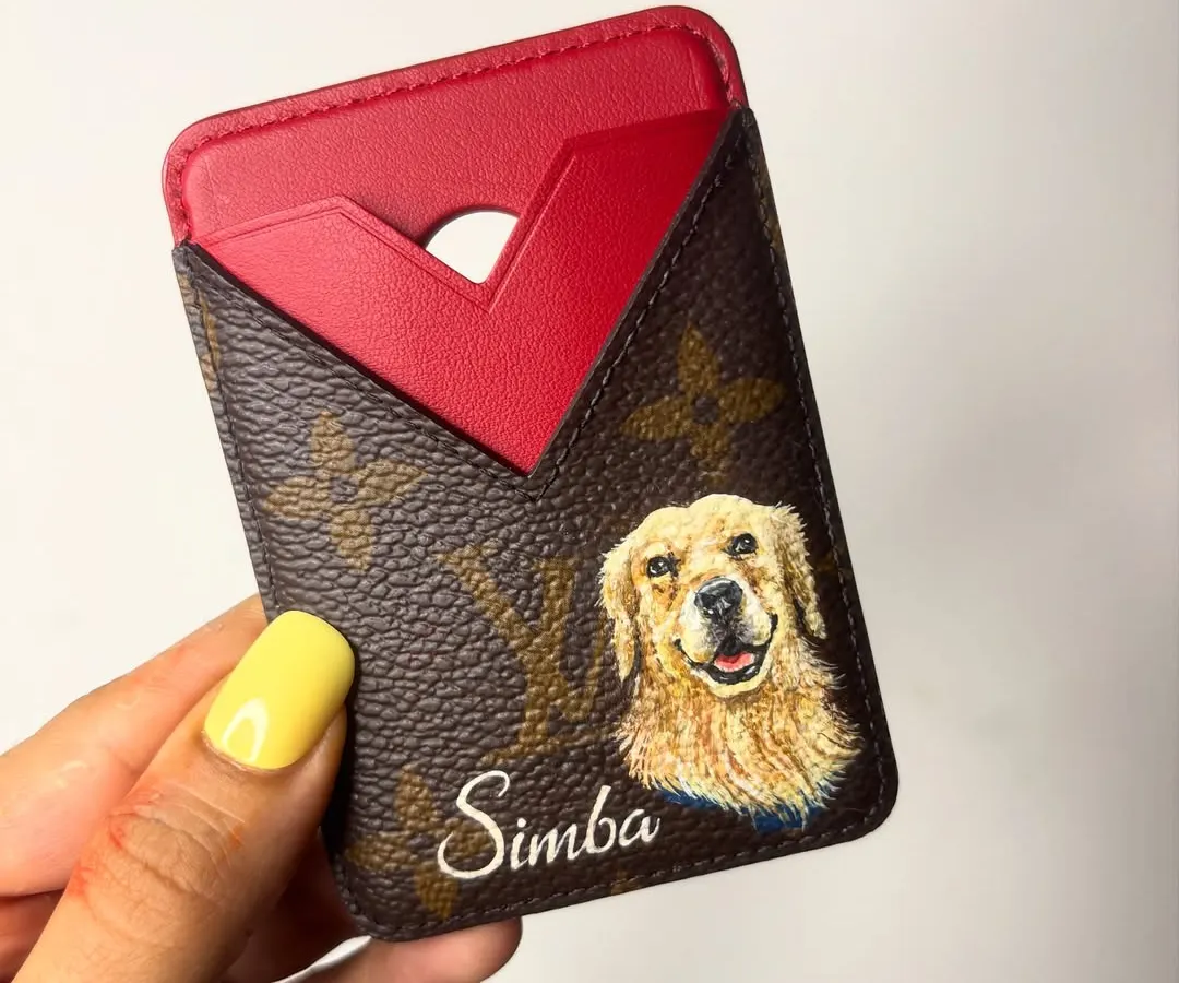 I love combining my art with high-end fashion. Here, I hand-painted a detailed portrait of a client's beautiful golden retriever, Simba, onto a Louis Vuitton cardholder, making it a truly personal luxury item.
